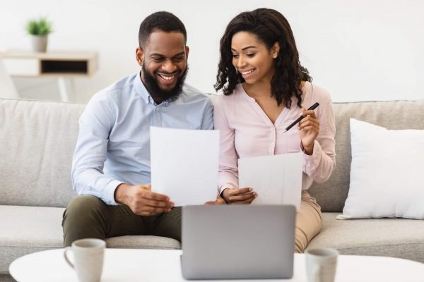 Caribbean Couple Reviewing Electricity Bill