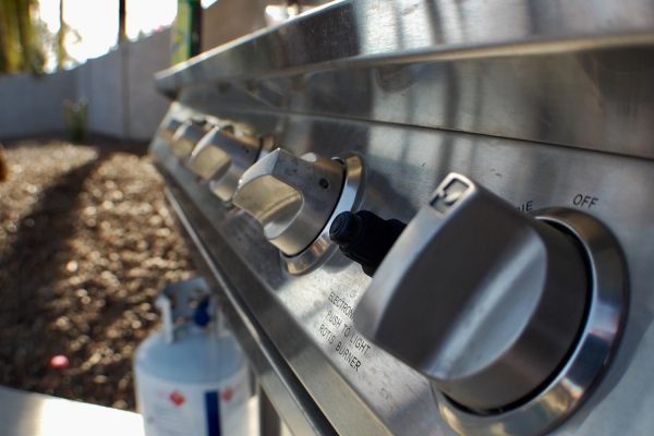 Controls Turned On An Outdoor Barbecue Grill With Propane